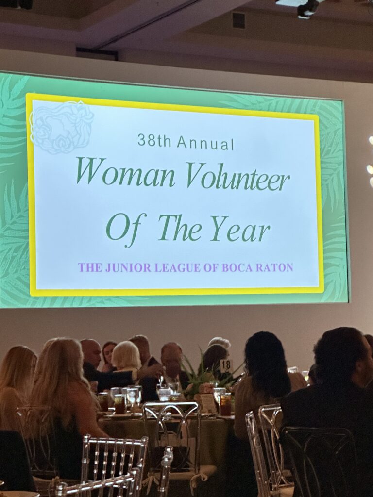 Event signage highlighting the 38th Annual Woman Volunteer of the Year celebration.